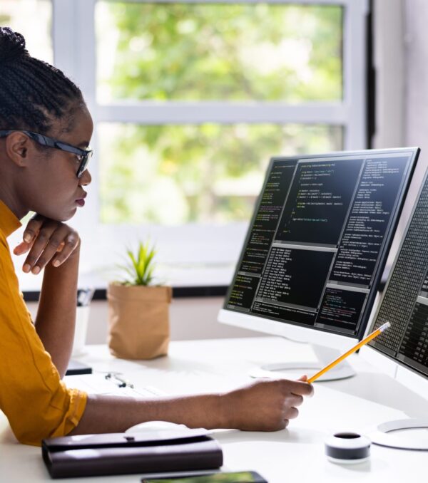 Female-Software-developer-writing-on-code-on-computer